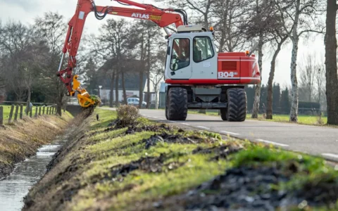 herder-mowing-bucket-ditch-maintenance
